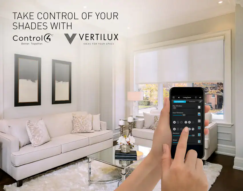 A person uses a smartphone app to control window shades in a bright, modern living room with white furniture. The image features the logos of Control4 and Vertilux and the text "Take control of your shades with.