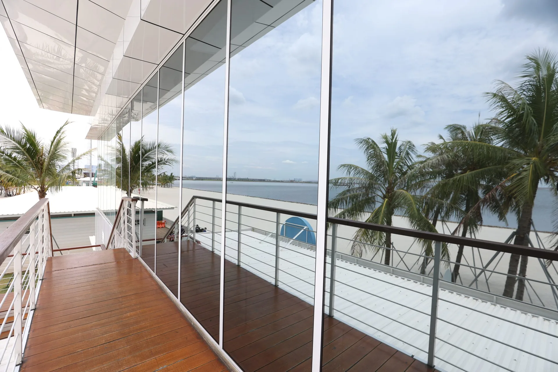 Window film on floor-to-ceiling glass overlooking the water